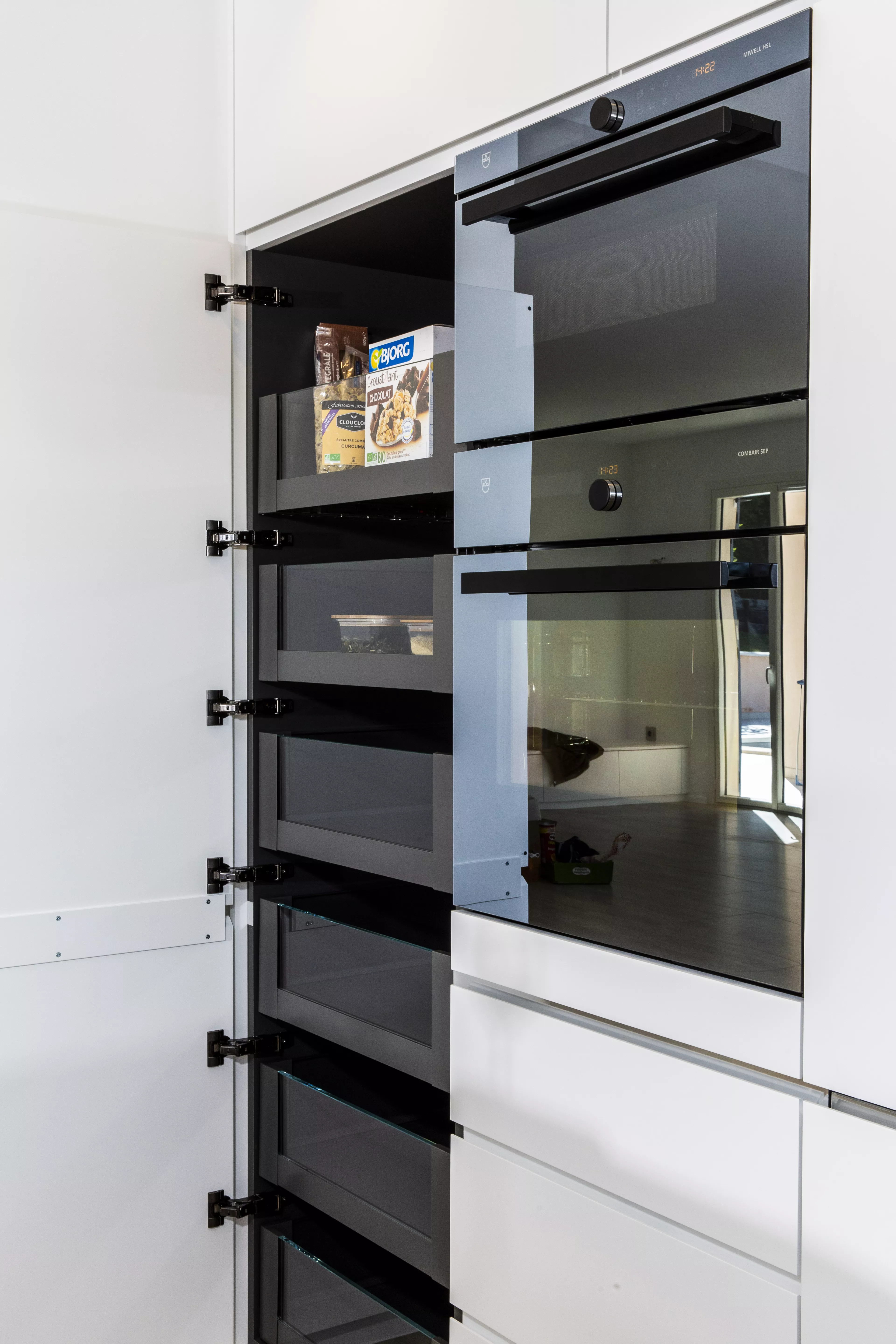 A contemporary, light-filled HIMACS kitchen with a mountain view