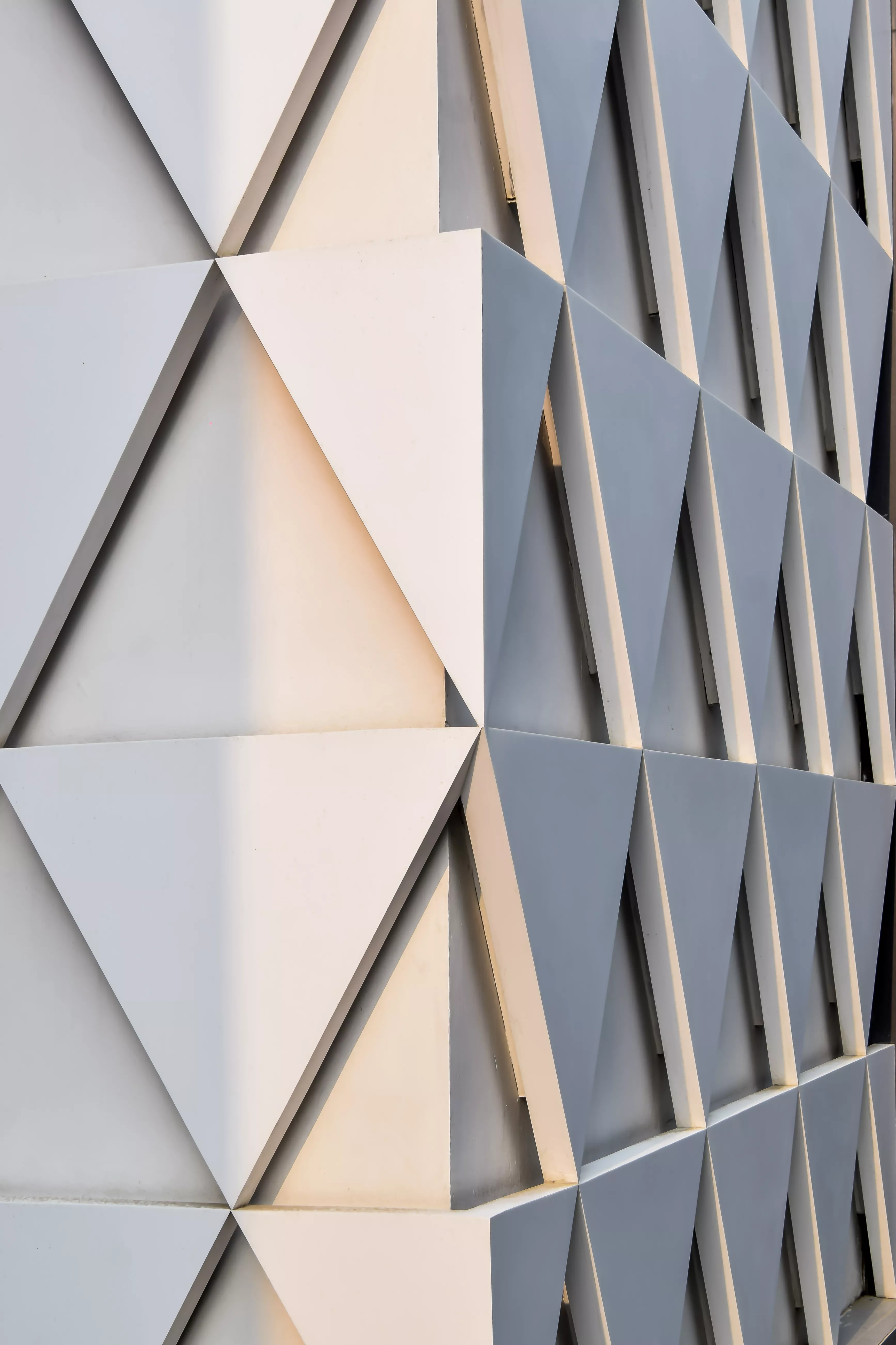 A sculptural, geometric façade made of HIMACS for JK House