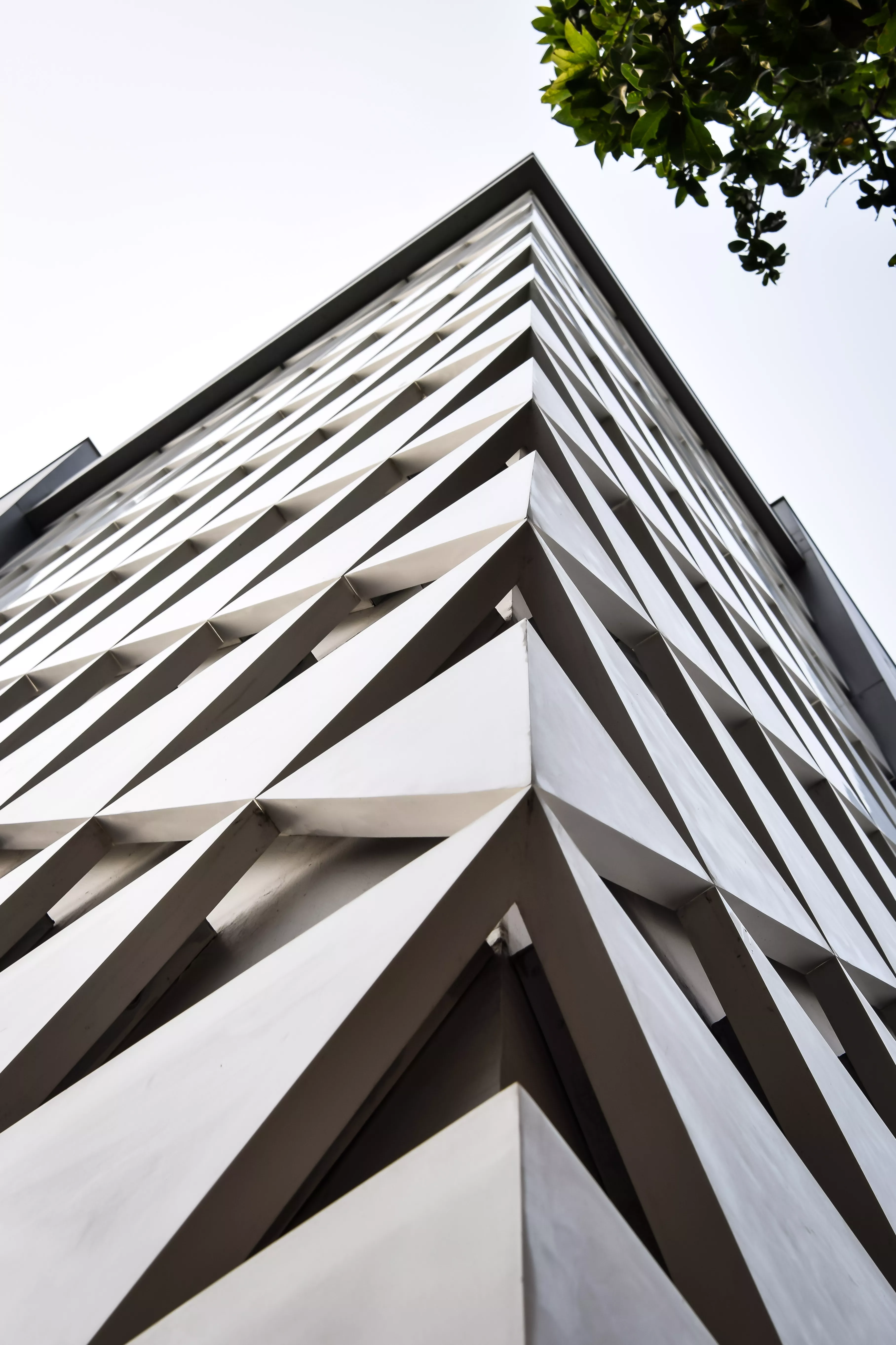 A sculptural, geometric façade made of HIMACS for JK House